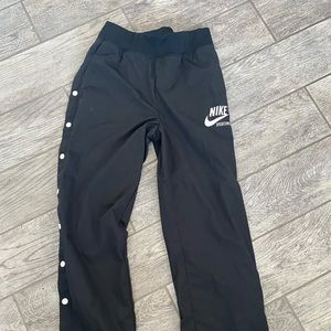 Nike track pants with bottoms on the side